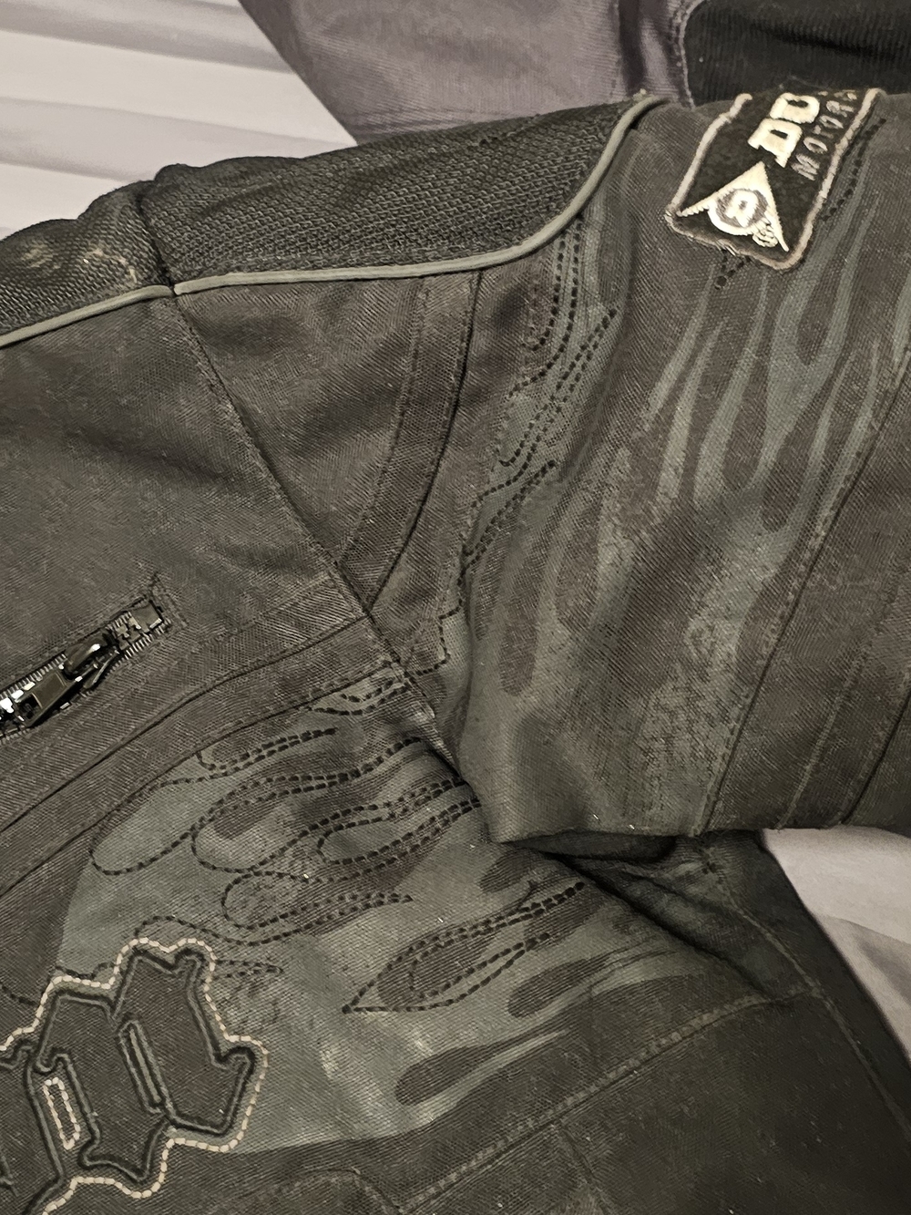 Black Motorcycle Jacket with Subtle Flame Details